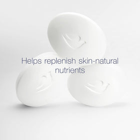 Close-up creamy lather of Dove bar demonstrating gentle moisturizing foam