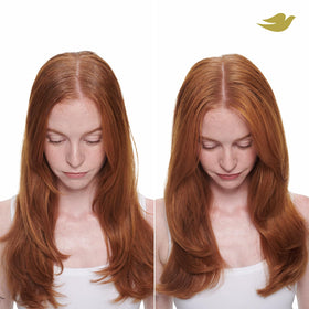 Woman with voluminous hair after using Dove set highlighting visible body