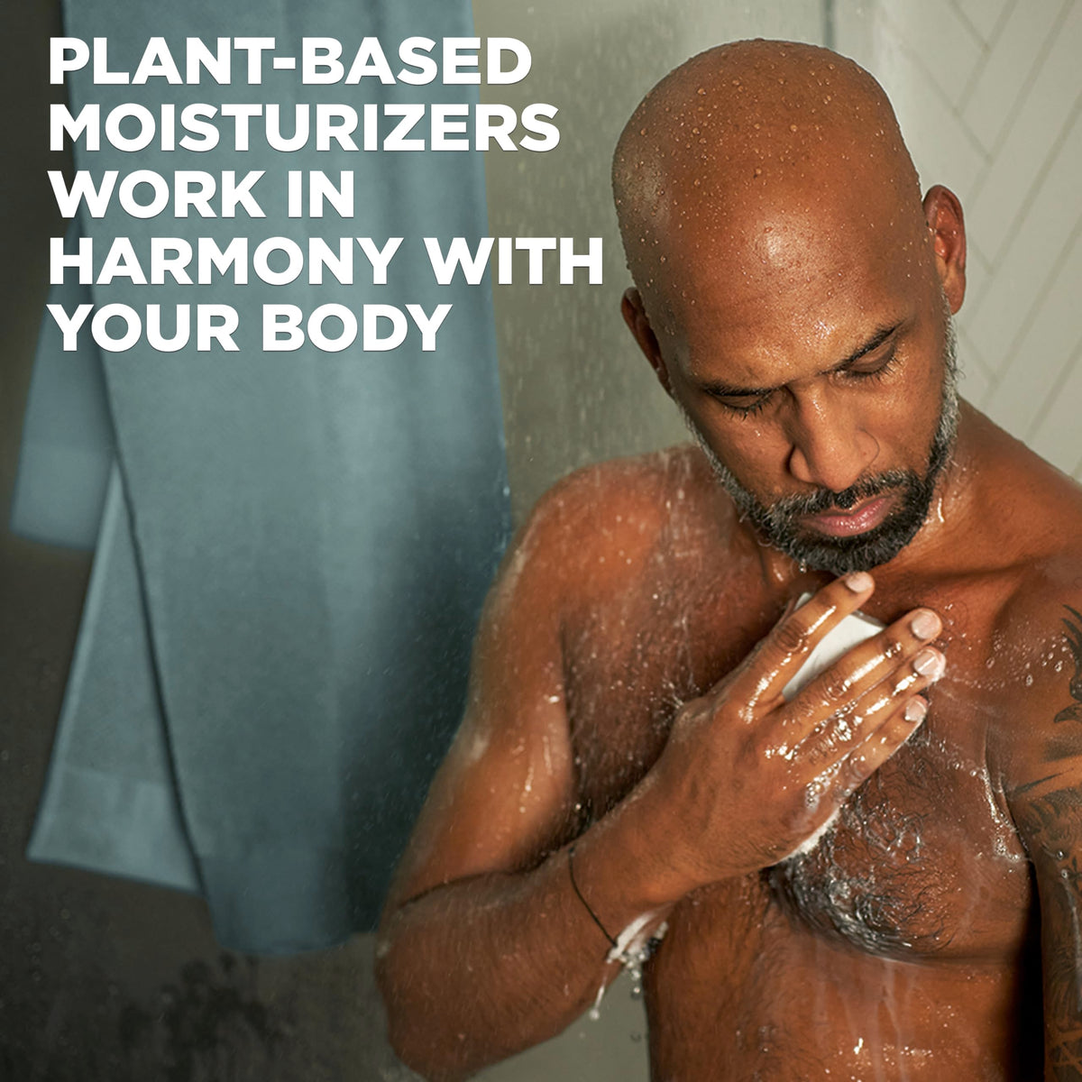 DOVE MEN + CARE bar resting in shower to show everyday grooming convenience benefit