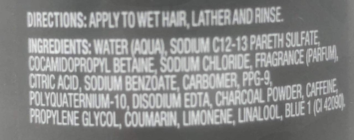 Dove Men+Care shampoo in a bathroom setting showing recyclable bottle and routine benefit