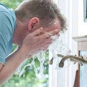DOVE MEN + CARE on bathroom shelf suggesting everyday routine