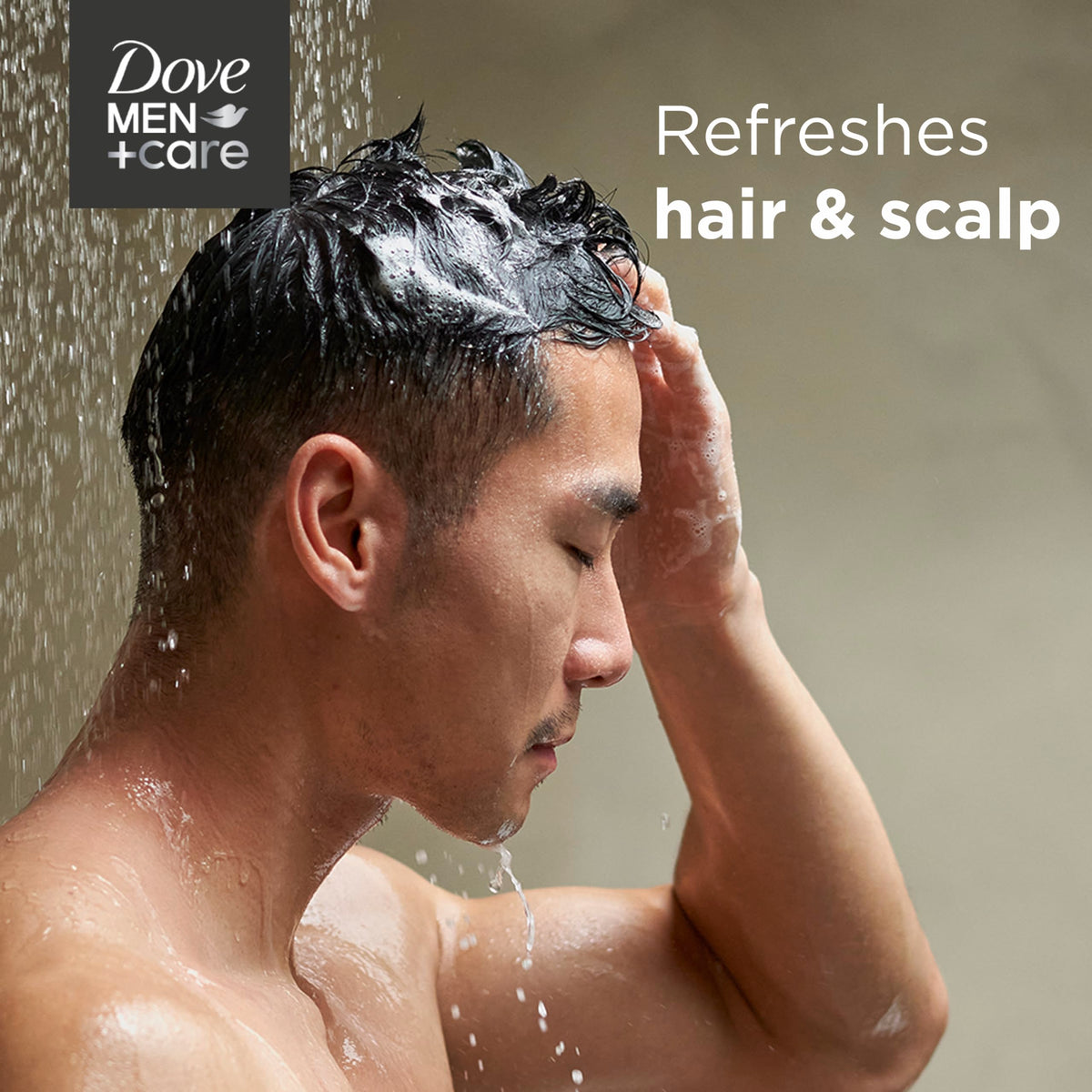 DOVE MEN + CARE size comparison with hand to show bottle convenience