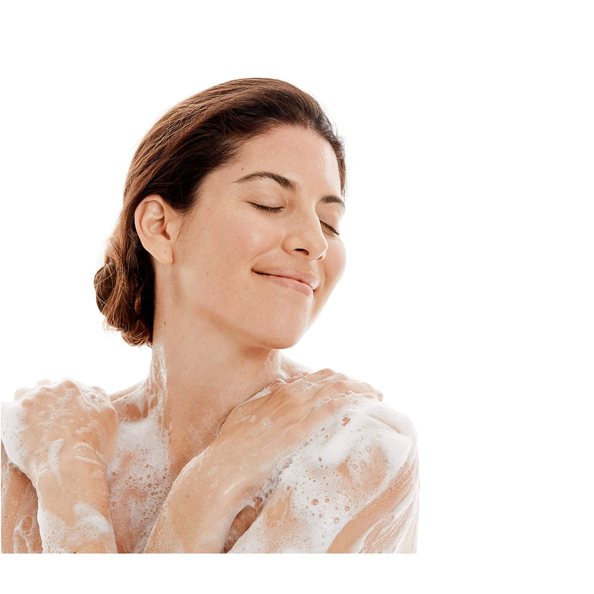 Hand dispensing Dove sensitive skin body wash to show creamy feel and easy application