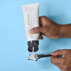 DPERM serum bottle close-up highlighting formula texture