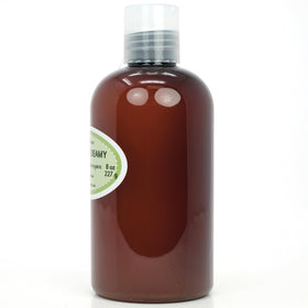 Dr Adorable applying oil to hair mid-lengths showing frizz control benefit
