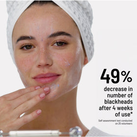 Dr. Brandt rinsing mask under water illustrating easy removal benefit