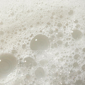 Dr. Bronner's in use washing dishes showing effective multipurpose cleaning
