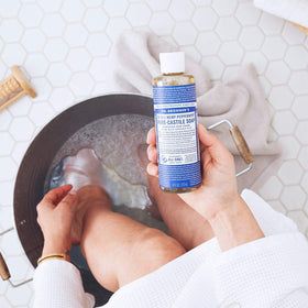 Dr. Bronner's soap lather texture demonstrating concentrated foaming performance
