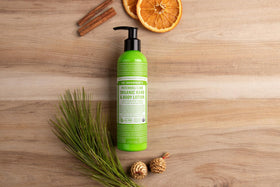Dr. Bronner's lotion in use on forearm demonstrating hydration and subtle patchouli lime scent