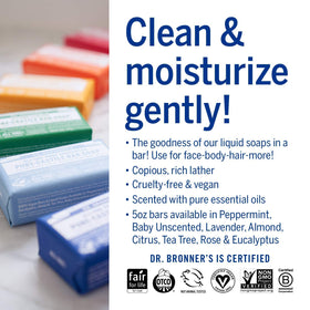 Dr. Bronner's bar in hand for scale showing compact 5 oz size for travel convenience