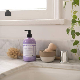 Dr. Bronner's tea tree foam close-up showing clarifying lather and cleansing action