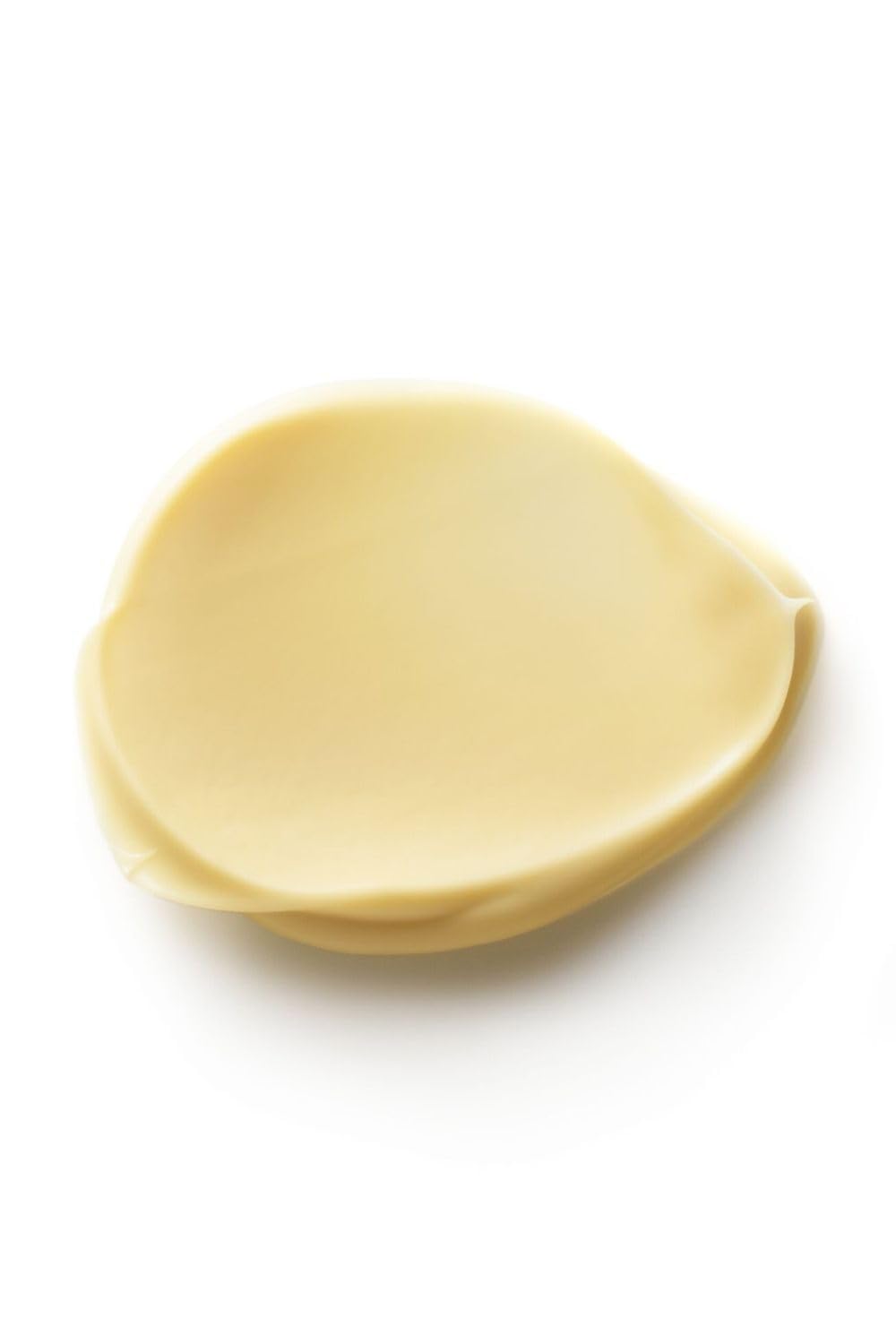 Dr. Hauschka applying cream to fingers demonstrating smooth spreadability benefit