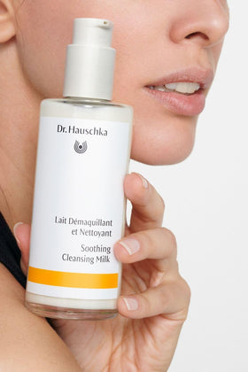 Dr. Hauschka cleansing milk on hand showing application and coverage benefit
