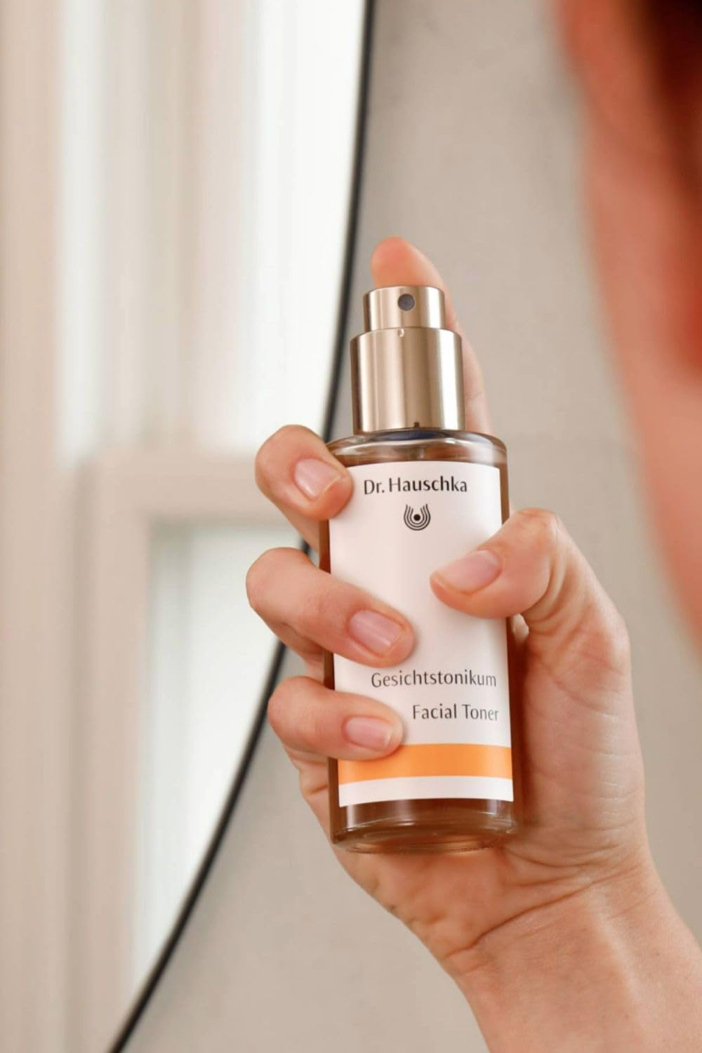Dr. Hauschka toner misting on face demonstrating quick hydration