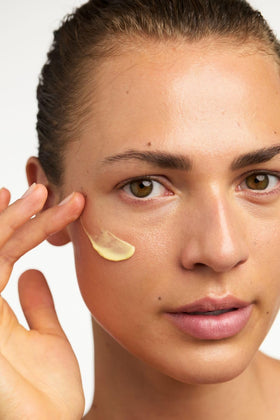 Dr. Hauschka cream being applied to hand demonstrating spreadability benefit: lightweight feel