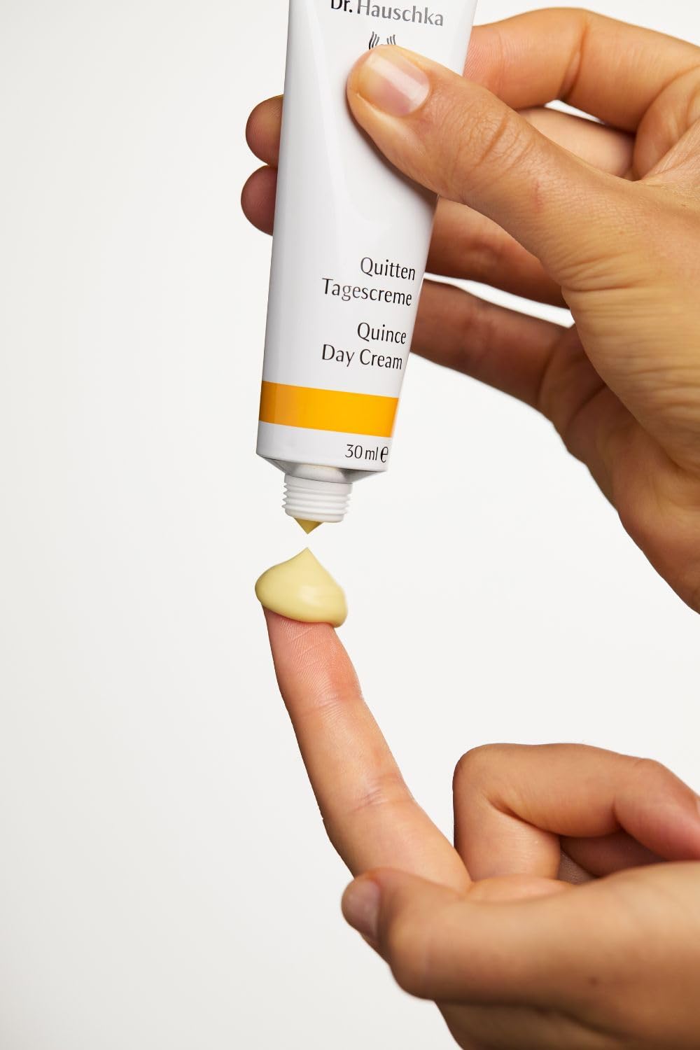Dr. Hauschka cream in a bathroom morning scene showing routine benefit: easy layering