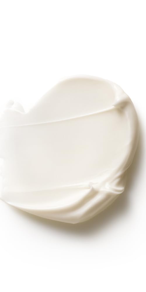 Dr. Hauschka applying cream on hand to demonstrate quick absorption benefit