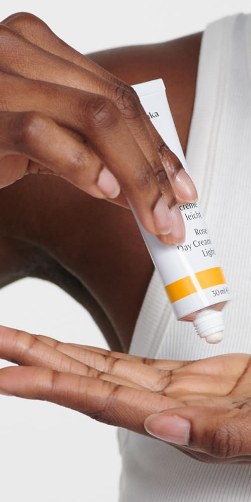Dr. Hauschka open cap revealing pale pink cream and natural ingredients