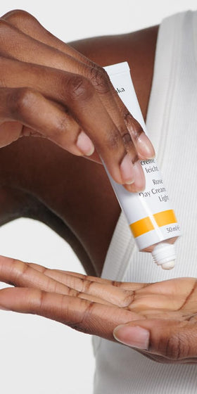 Dr. Hauschka open cap revealing pale pink cream and natural ingredients