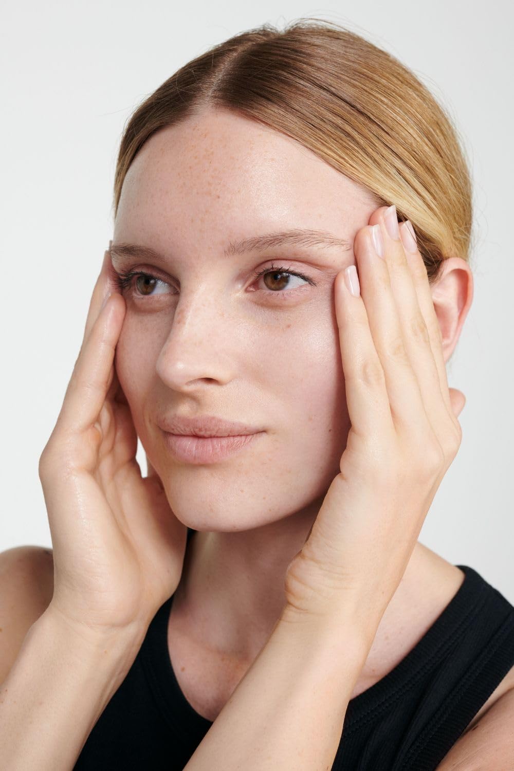 Dr. Hauschka being applied on hand illustrating lightweight hydration
