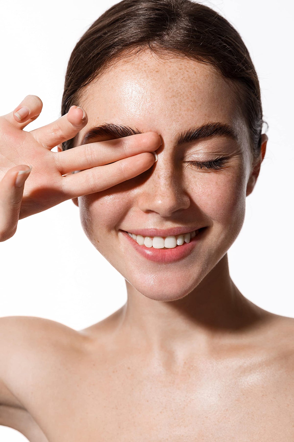 Dr Joe Lab bottle beside creams showing blendable skincare use