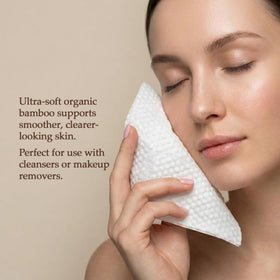 Dr. Nima's hands using towel to remove makeup for gentle cleansing