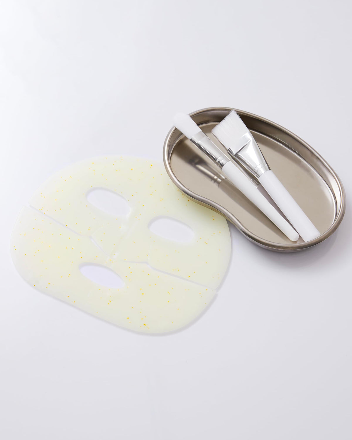 Dr.nineteen mask beside ampoule illustrating full-ampoule essence delivery