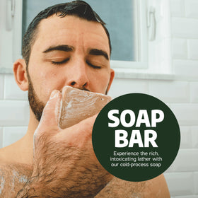 Dr. Squatch bar in a hand to show scale and portable five-ounce size