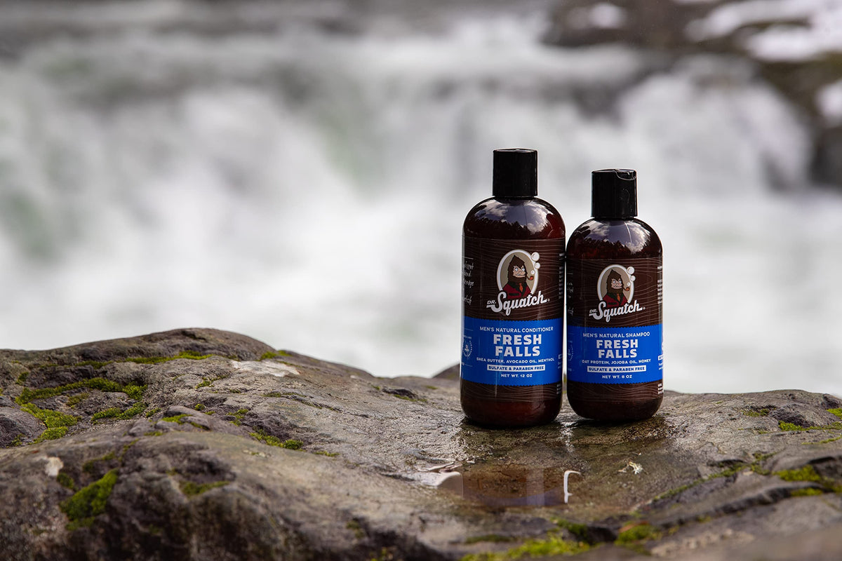 Dr. Squatch bottle beside common objects to show size and travel-friendly convenience