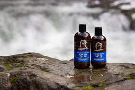 Dr. Squatch bottle beside common objects to show size and travel-friendly convenience