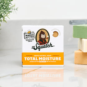 Dr. Squatch bar held in hand illustrating 5 oz size and convenient portability