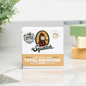 Dr. Squatch soap bar in hand demonstrating 5oz size and grip