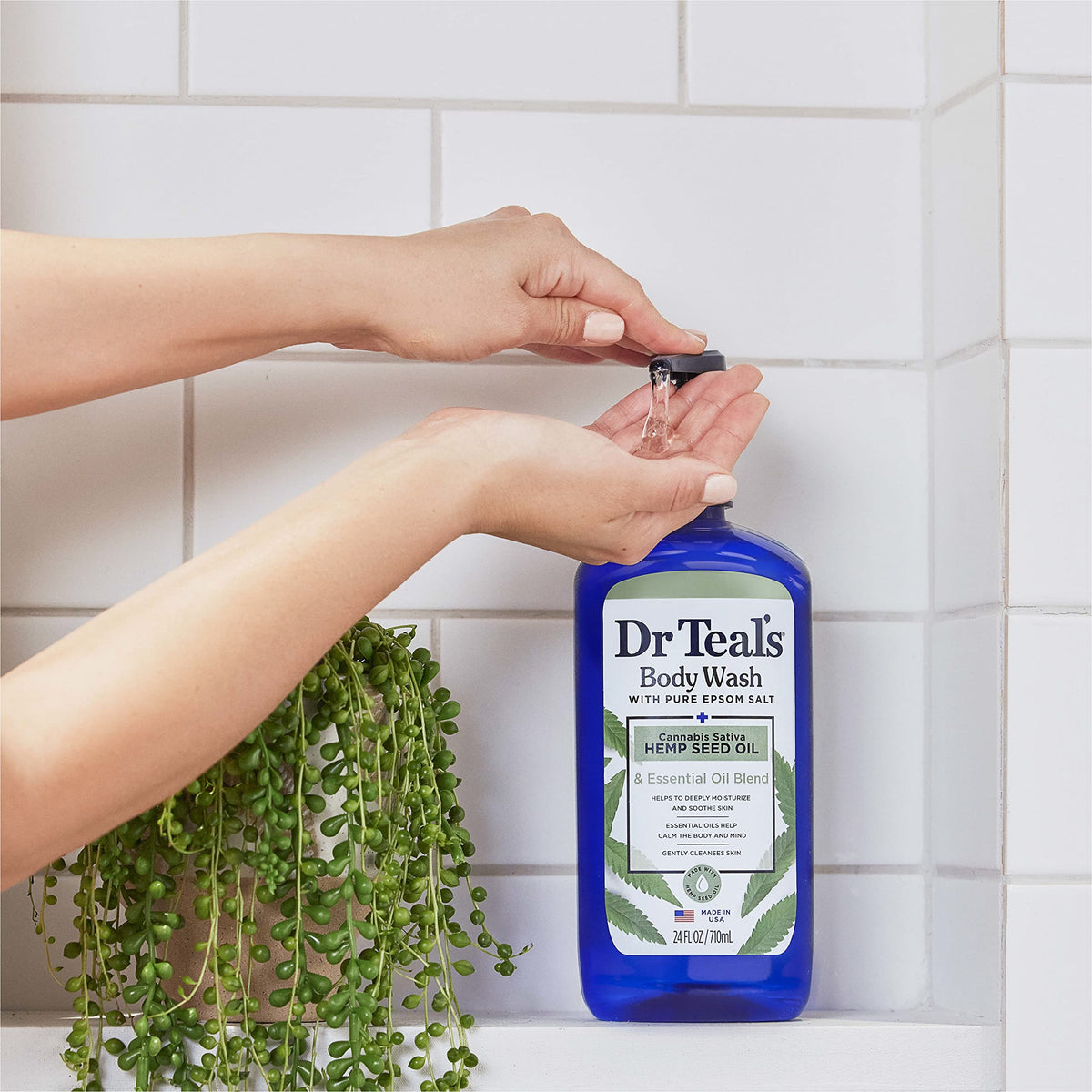 Dr Teal's body wash in hand showing usable amount and skin nourishment