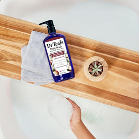 Dr Teal's key ingredients arranged: shea butter, almond oil, and Epsom salt for nourishing care
