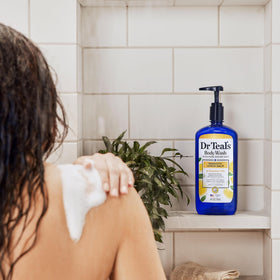 Dr Teal's Epsom salt granules beside bottle highlighting refreshing effect