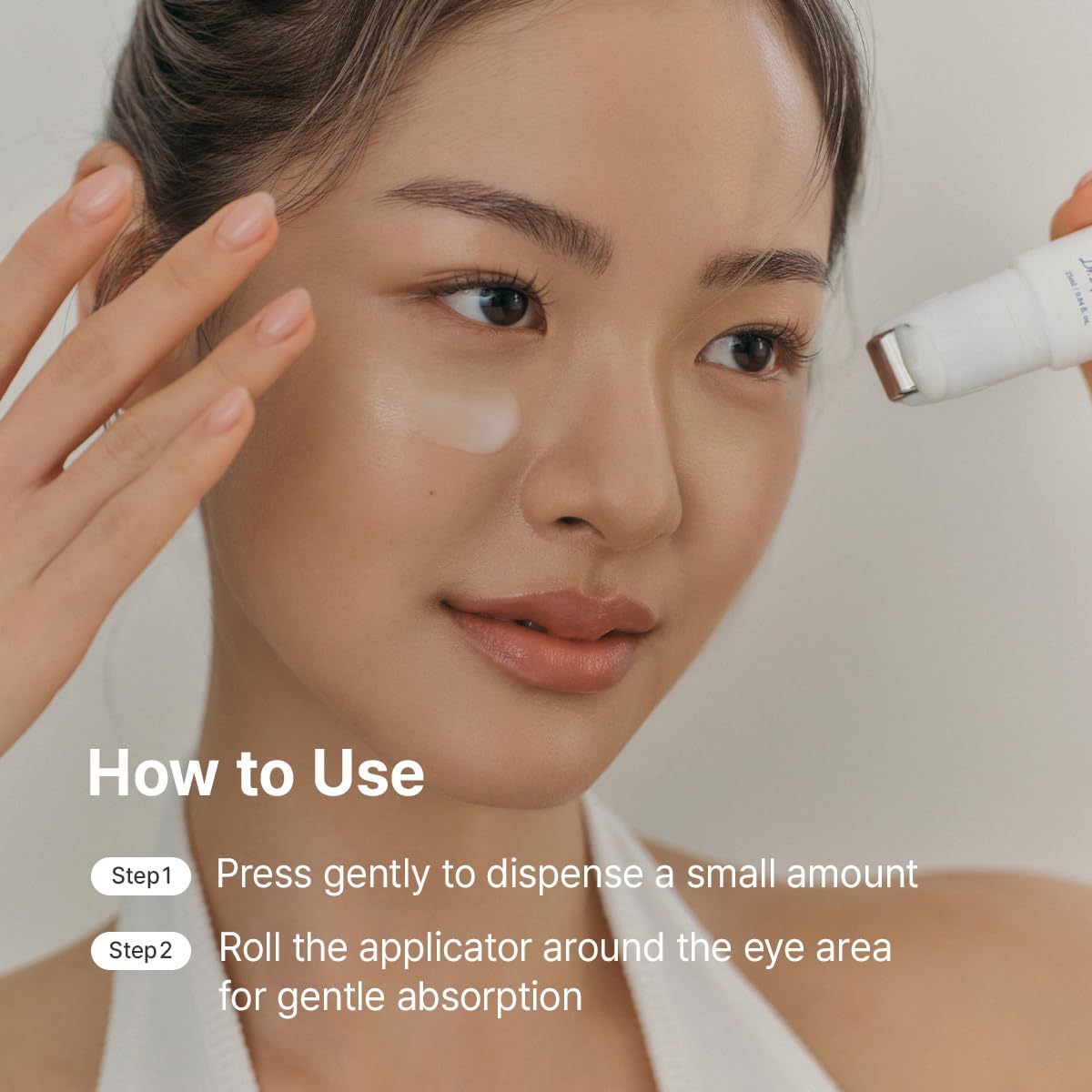 Dr.Althea roller applied under eye demonstrating lifting massage benefit