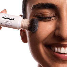 DRMTLGY application on makeup illustrating non-disruptive sunscreen touch-up