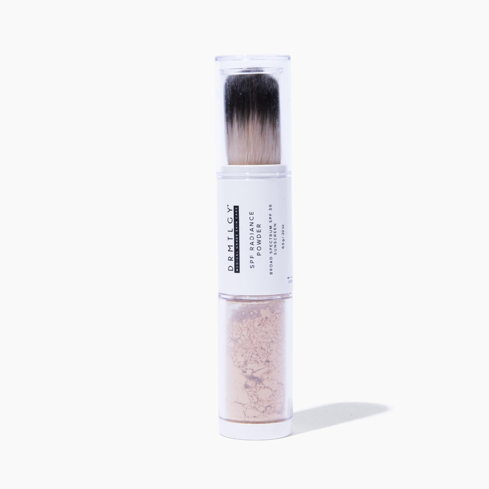 DRMTLGY front packaging showing compact SPF powder for travel convenience