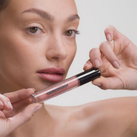 DRMTLGY Lip Silk Soft swatch on hand showing sheer Soft shade payoff