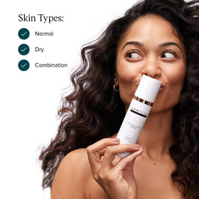 DRMTLGY toner held in hand to show 6.3 fl oz scale and everyday convenience