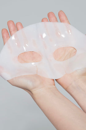 Dr.nineteen mask in use on model, demonstrates snug fit and relaxing at-home treatment