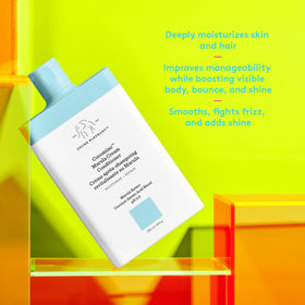 Drunk Elephant dispensing conditioner from pump demonstrating easy application and control
