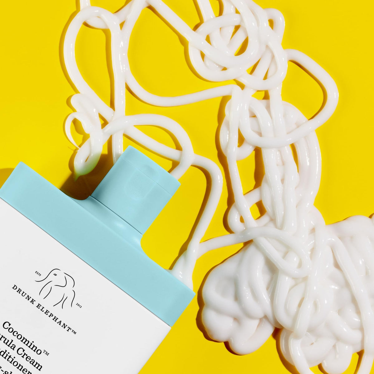Drunk Elephant texture close-up of creamy conditioner showing smooth, lightweight texture