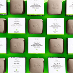 Drunk Elephant Juju Bar creamy lather on hand demonstrating effective cleansing and softness