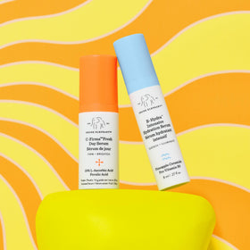 Drunk Elephant C‑Firma vitamin C serum droplets on skin showing brightening texture benefit