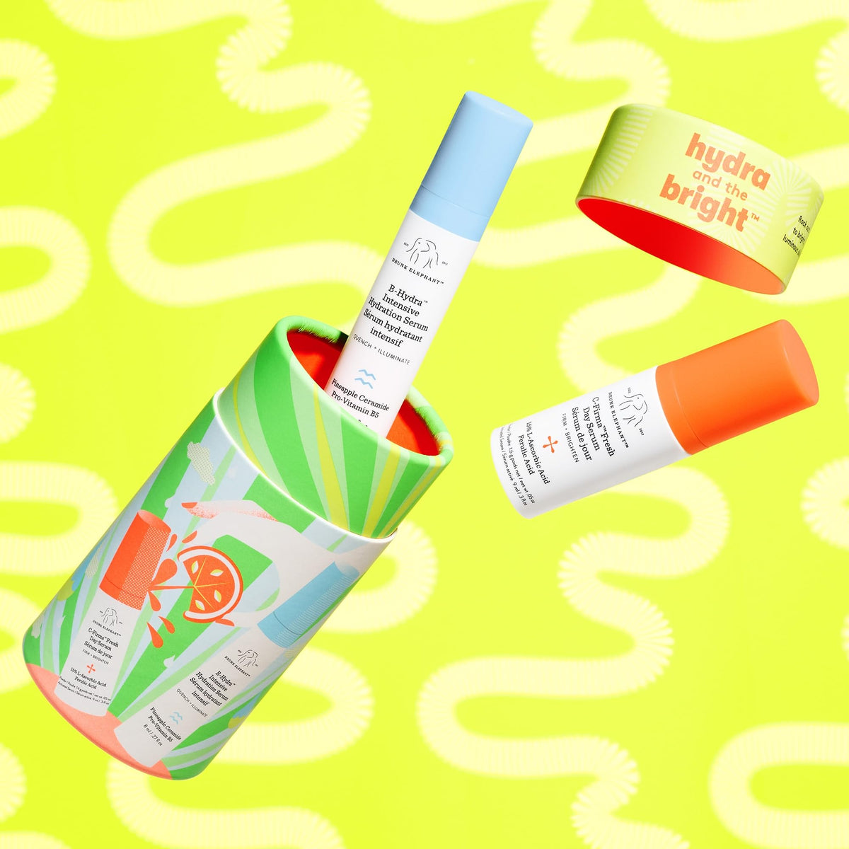 Drunk Elephant bottles held in hand showing compact size for easy packing benefit