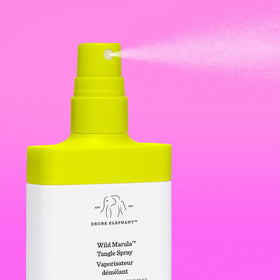 Drunk Elephant texture shot with marula oil drop showing moisturizing shine benefits
