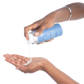 drybar size comparison next to hand showing product volume and portability