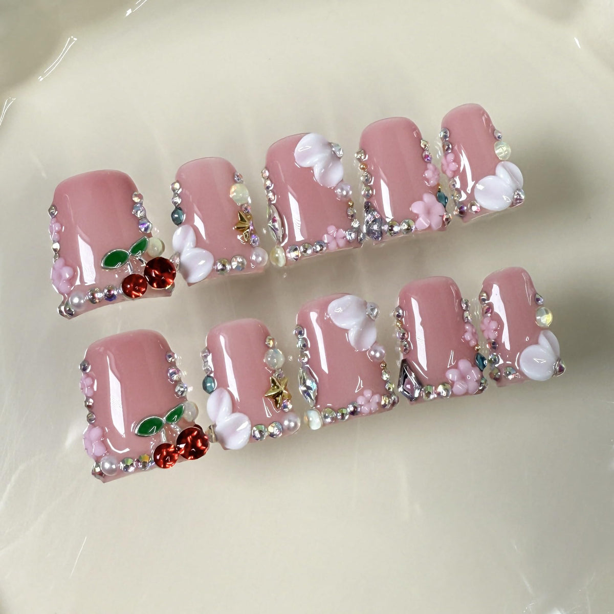 Duck pearl and rhinestone texture showing durable layered gel finish