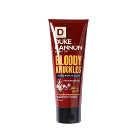Applying Duke Cannon balm to dry hands, showing immediate non-greasy comfort benefit